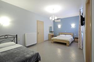 Ένα ή περισσότερα κρεβάτια σε δωμάτιο στο Olga Dova Apartments 