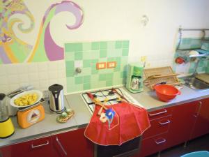 a kitchen with a counter top with a stove top oven at Miss Tortellino in Bologna