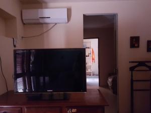 a flat screen tv sitting on top of a table at La casona de ensueño in Formosa