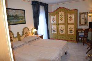 Кровать или кровати в номере Park Hotel Mater Dei