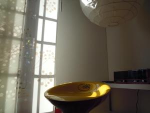 a yellow sink in a room with a window at Miss Tortellino in Bologna