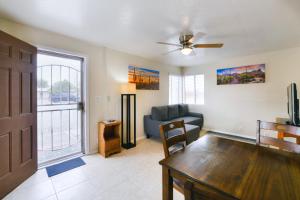 a living room with a couch and a table at Orchard Bungalow in Tucson