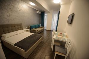 Postel nebo postele na pokoji v ubytování Solid Residence