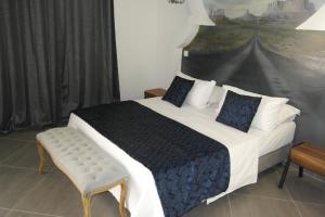 Una cama o camas en una habitación de Aparthotel Palace