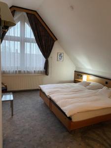 Postel nebo postele na pokoji v ubytování Hotel Seebach