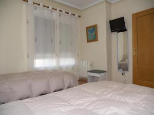 Postel nebo postele na pokoji v ubytování Apartamento Sanchiz