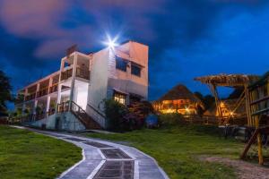 a building with a light on top of it at night at Prana in San Gil