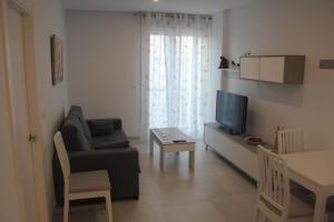 TV a/nebo společenská místnost v ubytování Apartamento Iceberg Tarifa Parking gratuito