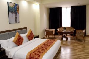 Postel nebo postele na pokoji v ubytování Hotel Tugos