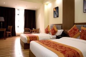 Postel nebo postele na pokoji v ubytování Hotel Tugos + 10 fotografií