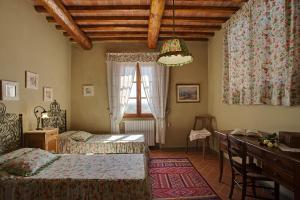 Ένα ή περισσότερα κρεβάτια σε δωμάτιο στο Sole del Chianti +86 φωτογραφίες