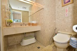 a bathroom with a toilet and a sink at Luxury House in Taichung