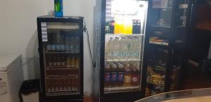 a refrigerator filled with lots of different types of drinks at HOTEL CASA COLONIAL in San Antonio del Táchira