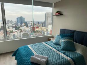 Katil atau katil-katil dalam bilik di Apartamento de 2 habitaciones junto al WTC