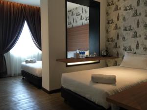 Letto o letti in una camera di D Elegance Hotel Nusajaya