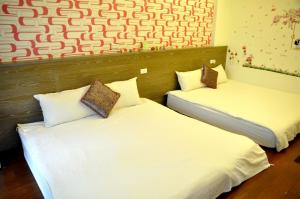 Katil atau katil-katil dalam bilik di Sky Bird Garden B&B