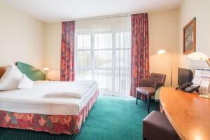 Ein Bett oder Betten in einem Zimmer der Unterkunft Trip Inn Hotel Dasing-Augsburg