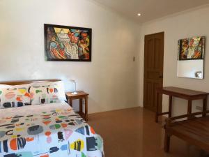 Postel nebo postele na pokoji v ubytování Strutz Art Garden Resort