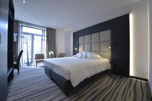 Postel nebo postele na pokoji v ubytování Hotel Monarc