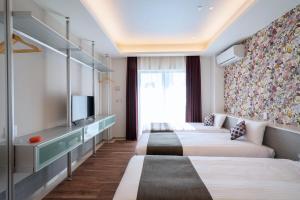Postel nebo postele na pokoji v ubytování Hotel SAILS Asakusa