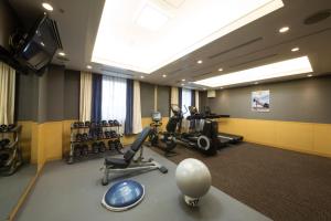 a gym with treadmills and exercise equipment in a room at ANA Crowne Plaza Yonago by IHG in Yonago