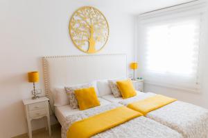 Posteľ alebo postele v izbe v ubytovaní 4SEASONS SAN NICOLAS APARTMENT