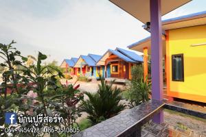 a row of colorful houses in a row at Banphu Resort - บ้านปู รีสอร์ท in Rayong