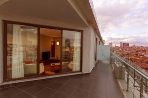 a balcony of a building with a view of a city at Nippon Hotel in Istanbul