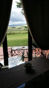 a view of a table and chairs from a window at River Crossing in Champagne Valley
