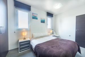 A bed or beds in a room at Aqua Nature 27D