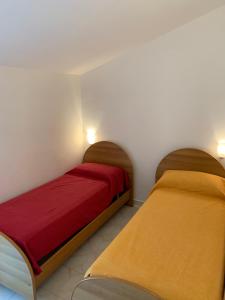 מיטה או מיטות בחדר ב-Casa del gelso