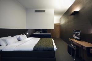 Postel nebo postele na pokoji v ubytování Carbon Hotel