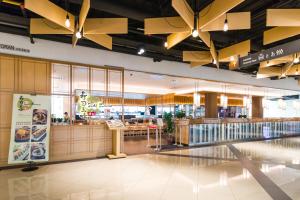 a fast food restaurant with yellow ceiling at EkoCheras Cozy Suite by DreamScape in Kuala Lumpur