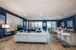a living room with blue walls and a white couch at Varios Resort Pool Homes in Davenport