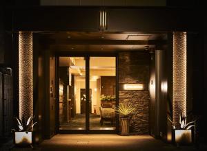 an entrance to a building at night at HOTEL THE ROCK in Osaka