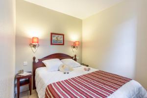 Ein Bett oder Betten in einem Zimmer der Unterkunft Résidence Pierre & Vacances Le Domaine de Gascogne