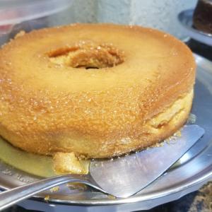 a cake sitting on top of a plate with a fork at Hotel Uzi Mar in Recife