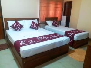 Letto o letti in una camera di Honey Tree Polonnaruwa
