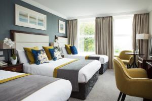 Rúm í herbergi á Anner Hotel
