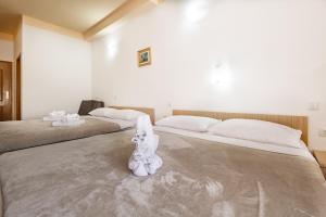 Postel nebo postele na pokoji v ubytování Hotel Ami - M