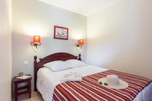 Ein Bett oder Betten in einem Zimmer der Unterkunft Résidence Pierre & Vacances Le Domaine de Gascogne