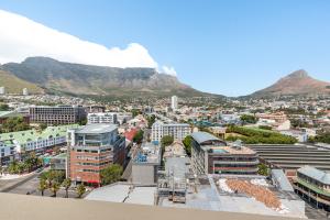 a view of cape town with table mountain in the background at Four Seasons Apartments in Cape Town