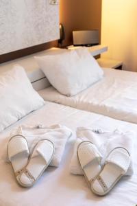 Postel nebo postele na pokoji v ubytování Eburon Hotel