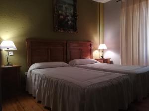 Postel nebo postele na pokoji v ubytování La Cerca