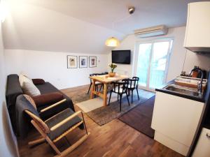 a living room with a couch and a table at Apartments Poldi in Bled