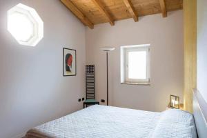 En eller flere senger på et rom på Villa Siresola