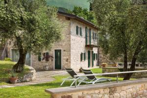 a couple of chairs sitting in front of a building at Villa Siresola in Malcesine