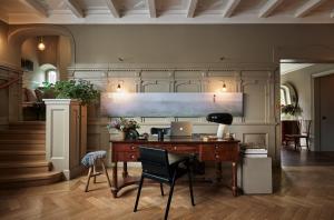 an office with a desk with a laptop on it at Ett Hem in Stockholm