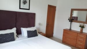 Llit o llits en una habitació de Sacha Tourist Residence 2