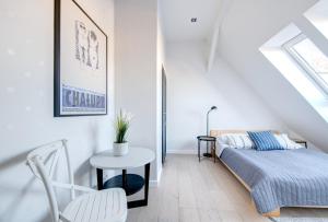 Postel nebo postele na pokoji v ubytování DR Apartments - Loft 2